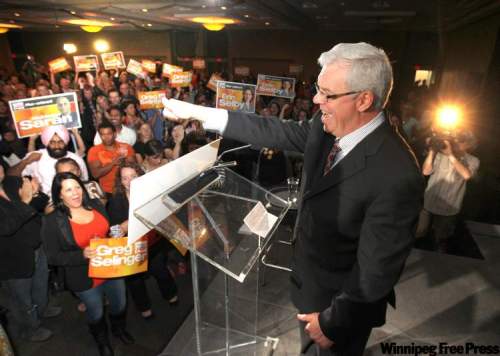 Ruth Bonneville / Winnipeg Free Press
Premier Greg Selinger gives the thumbs-up to hundreds of supporters at the convention centre Tuesday night.