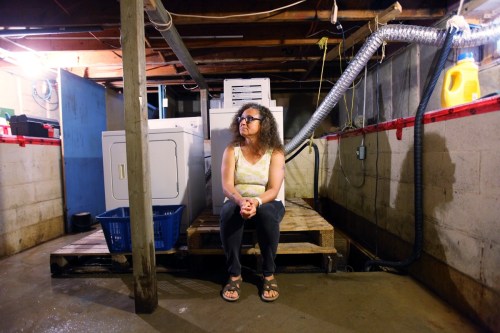 Tim Smith / Brandon Sun
Jean Halliday sits in her basement, still wet from recent overland flooding, in her home on 16th Street North in Brandon on Tuesday.