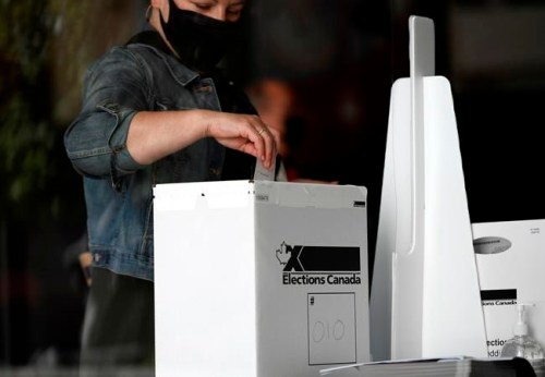 A voter casts their ballot at a polling location on election day during the 44th Canadian general election, on Monday, Sept. 20, 2021. THE CANADIAN PRESS/Justin Tang