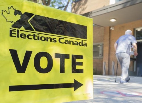 A man arrives to cast his ballot on federal election day in Montreal, Monday, Sept. 20, 2021. THE CANADIAN PRESS/Graham Hughes