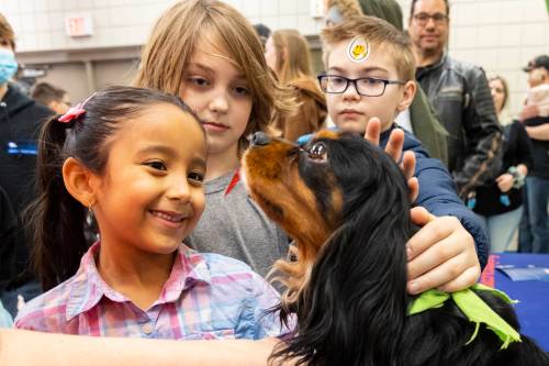 Chelsea Kemp/The Brandon Sun
Aimee, 6, Austin, 11, and Nolan, 9, visit with Ringo Starr Friday during a WoofJocks meet and greet.