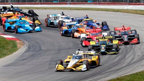 Josef Newgarden leads the field after taking the green flag at the start of an IndyCar race at Mid-Ohio Sports Car Course in Lexington, Ohio, Sunday, July 4, 2021. Newgarden snapped his streak of late race misfortunes Sunday to win for the first time this season, earning the first IndyCar victory of the year for Team Penske on the same weekend the storied organization celebrated the 50th anniversary of its first win. (AP Photo/Tom E. Puskar)