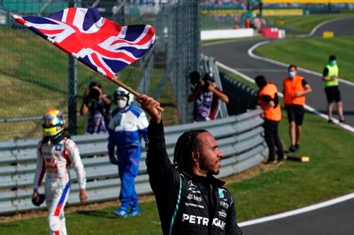 Mercedes driver Lewis Hamilton of Britain celebrates after winning the British Formula One Grand Prix, at the Silverstone circuit, in Silverstone, England, Sunday, July 18, 2021. (AP Photo/Jon Super)