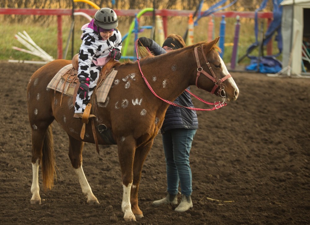 Cadee Sobry, 9, and her horse Doc prepare to race in the Lucky Break Ranch Halloween Jackpot Race Sunday. (Chelsea Kemp/The Brandon Sun)