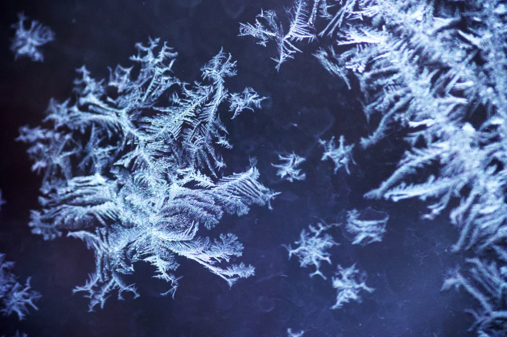 Patterns of frost that formed on my porch windows overnight on Monday are seen here against the light from the house next door. (Matt Goerzen/The Brandon Sun)