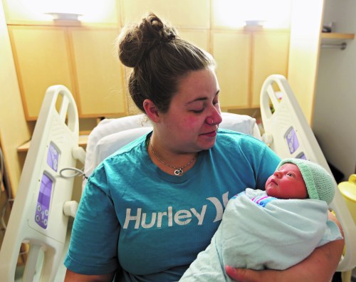 11:09 p.m. — Dayna Cooper holds one-day-old Bailee Stowe at the Brandon Regional Health Centre. Bailee was born on Halloween and her parents, Cooper and Tyler Stowe, were excited to take her home to Moosomin. (Charles Tweed/Brandon Sun)