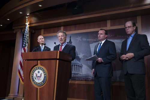 A group of Republican senators, from left, Sen. Rick Scott, R-Fla., Sen. Rand Paul, R-Ky., Sen. Mike Lee, R-Utah, and Sen. Mike Braun, R-Ind., tell reporters that the COVID-19 vaccine mandate for members of the U.S. military should be rescinded under the annual defense bill, at the Capitol in Washington, Wednesday, Dec. 7, 2022. (AP Photo/J. Scott Applewhite)