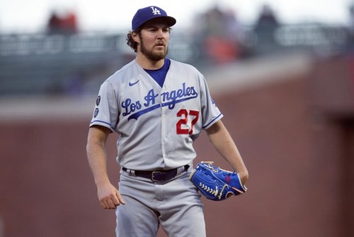 FILE - Los Angeles Dodgers starting pitcher Trevor Bauer pauses while working against the San Francisco Giants during the fourth inning of a baseball game May 21, 2021, in San Francisco. Bauer was reinstated Thursday, Dec. 22, 2022, by Major League Baseball's independent arbitrator, allowing the pitcher to resume his career at the start of the 2023 season. (AP Photo/D. Ross Cameron, File)