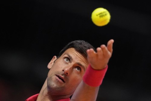 Serbia's Novak Djokovic of Falcons, serves to Austria's Sebastian Ofner of Kites, during a match of the World Tennis League at Coca-Cola Arena, in Dubai, United Arab Emirates, Friday, Dec. 23, 2022. (AP Photo/Kamran Jebreili)