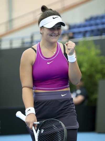 Canada's Bianca Andreescu celebrates her win over Spain's Garbiñe Muguruza during their Round of 32 match at the Adelaide International tennis tournament in Adelaide, Australia, Sunday, Jan. 1, 2023. (AP Photo/Kelly Barnes)