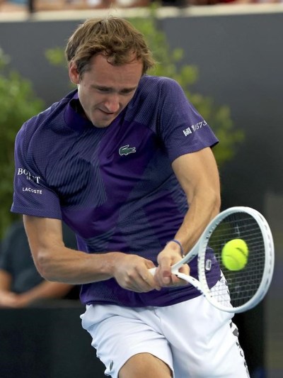 Russia's Daniil Medvedev makes a backhand return to Italy's Lorenzo Sonego during their Round of 32 match at the Adelaide International Tennis tournament in Adelaide, Australia, Tuesday, Jan. 3, 2023. (AP Photo/Kelly Barnes)