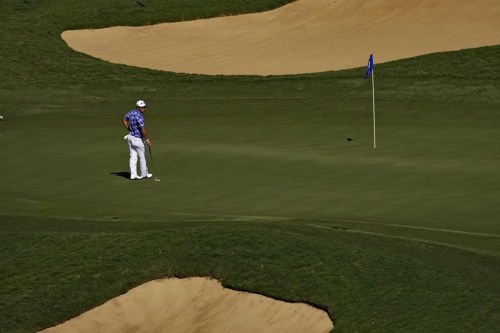 Hideki Matsuyama, of Japan, waits to hit on the eighth green during the third round of the Tournament of Champions golf event, Saturday, Jan. 7, 2023, at Kapalua Plantation Course in Kapalua, Hawaii. (AP Photo/Matt York)