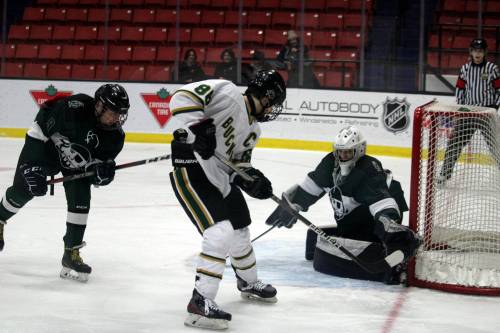 Dauphin Clippers goaltender Owen Chubka turns aside a shot from Miles Macdonell Buckeyes forward Kyle Chapko during Thursday’s contest at Westoba Place. (Lucas Punkari/The Brandon Sun)