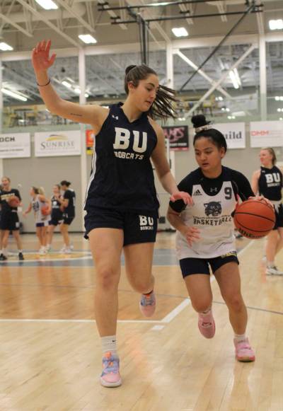 Noah Garcia defends Rae Lee Torino during Brandon University Bobcats women's basketball practice on Wednesday. The Bobcats are hoping to get their forwards more involved offensively in the second half of the Canada West season. (Thomas Friesen/The Brandon Sun)