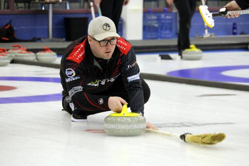 Third James Hay delivers a rock for Jay Kinnaird’s rink from Virden during the opening draw of the Brandon men's competitive bonspiel at the Brandon Curling Club on Friday night. (Lucas Punkari/The Brandon Sun)