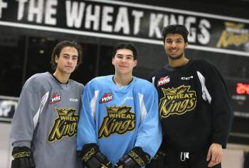 The three newest members of the Bradnon Wheat Kings, from left to right, Dawson Pasternak, Nolan Flamand and Kayden Sadhra-Kang, pose for a picture after practice at Westoba Place on Thursday. The Wheat Kings host the Medicine Hat Tigers tonight. (Perry Bergson/The Brandon Sun)