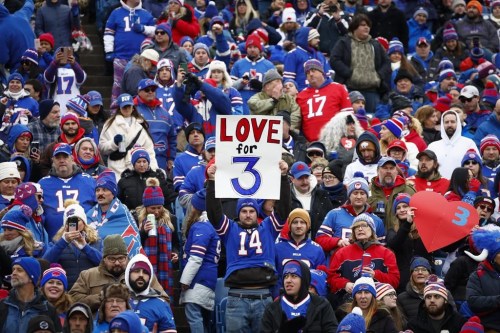 Fans hold signs in support of safety Damar Hamlin before an NFL football game against the New England Patriots, Sunday, Jan. 8, 2023, in Orchard Park, N.Y. Hamlin remains hospitalized after suffering a catastrophic on-field collapse in the team's previous game against the Cincinnati Bengals. (AP Photo/Jeffrey T. Barnes)