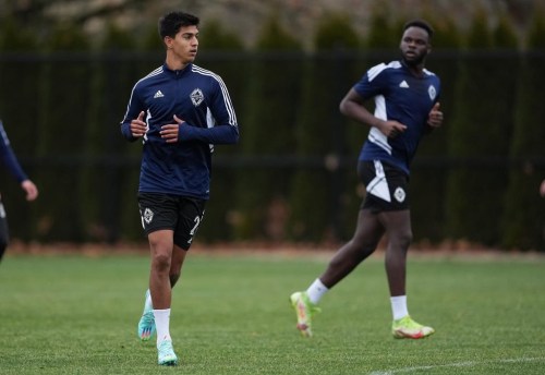 Vancouver Whitecaps defenders Mathias Laborda, front left, and Karifa Yao participate in a drill during the opening day of the MLS soccer team's training camp, in Vancouver, on Monday, January 9, 2023. THE CANADIAN PRESS/Darryl Dyck