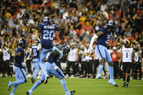 Toronto Argonauts defensive back Jamal Peters (3) celebrates after scoring a touchdown by intercepting a pass by Hamilton Tiger-Cats quarterback Dane Evans (9), during second half CFL football action in Toronto, on Friday, August 26, 2022.THE CANADIAN PRESS/Christopher Katsarov