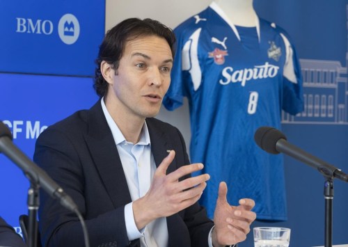 President and CEO of CF Montreal Gabriel Gervais speaks to the media during a news conference, Tuesday, March 29, 2022 in Montreal. CF Montreal has terminated the contract of its reserve squad coach Sandro Grande less than a day after hiring him after political backlash over previous comments about Quebec's 2012 election night shooting.THE CANADIAN PRESS/Ryan Remiorz