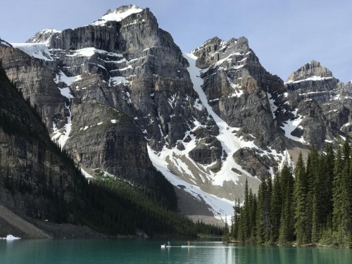 Paddle boarders are seen on Moraine Lake in Lake Louise, Alta., in June 2020. THE CANADIAN PRESS/Jonathan Hayward