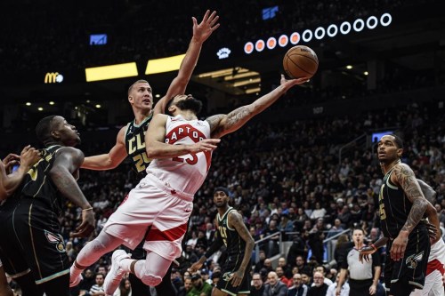 Toronto Raptors guard Fred VanVleet (23) lays up the ball past Charlotte Hornets centre Mason Plumlee (24) during first half NBA basketball action in Toronto on Tuesday, January 10, 2023. THE CANADIAN PRESS/Christopher Katsarov