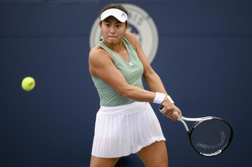 Carol Zhao, of Canada, returns the ball during a match against Amanda Anisimova, of the USA, at the National Bank Open tennis tournament in Toronto, on Tuesday, Aug. 9, 2022. THE CANADIAN PRESS/Christopher Katsarov