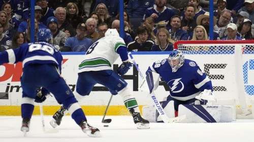 Vancouver Canucks center J.T. Miller (9) prepares to score on Tampa Bay Lightning goaltender Andrei Vasilevskiy (88) during the second period of an NHL hockey game Thursday, Jan. 12, 2023, in Tampa, Fla. (AP Photo/Chris O'Meara)