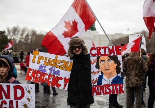 Demonstrators gather to protest against COVID-19 measures and in support of a demonstration in Ottawa which has grown to a broader anti-government demonstration, in Edmonton on Feb. 19, 2022. (The Canadian Press)